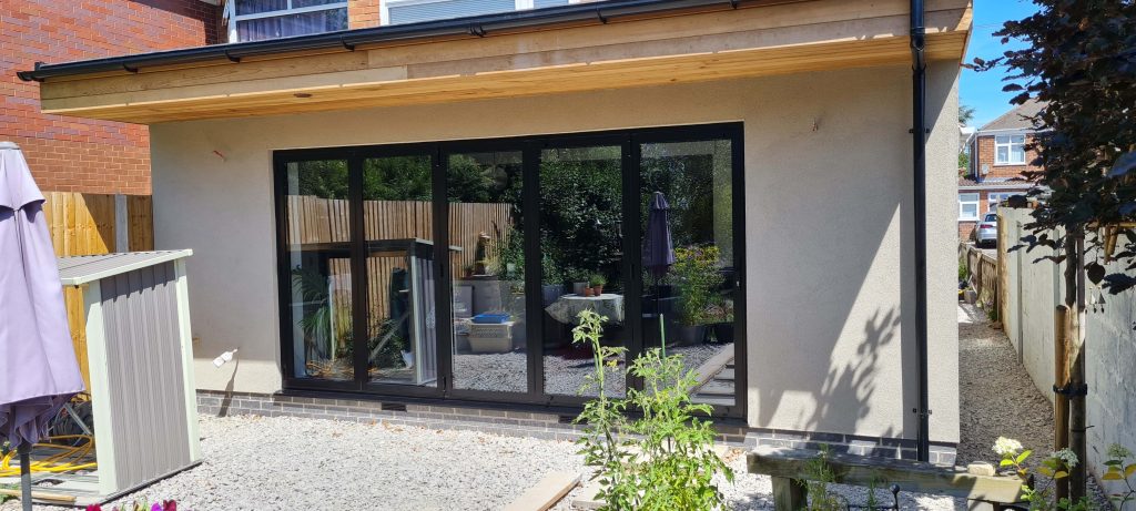 Rear house extension with black bi-fold doors in Staffordshire