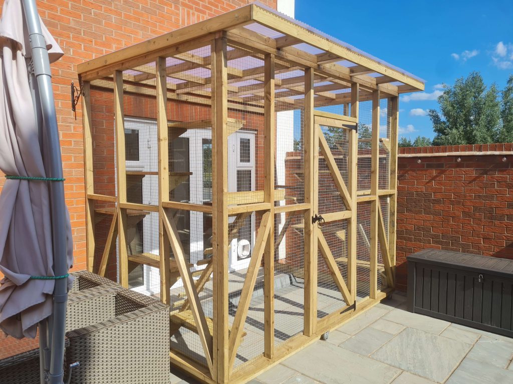 Wooden animal hut and outdoor pet enclosure in Staffordshire