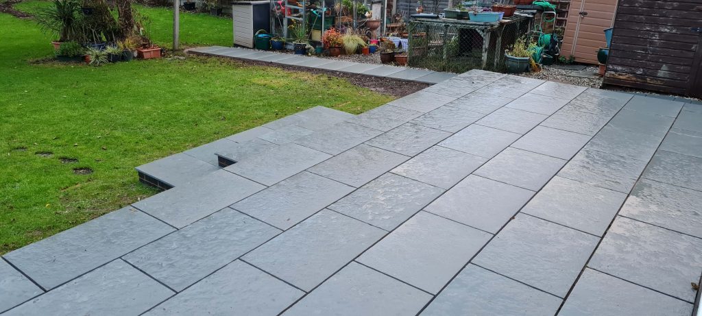 Grey garden patio paving with lawn area in Staffordshire