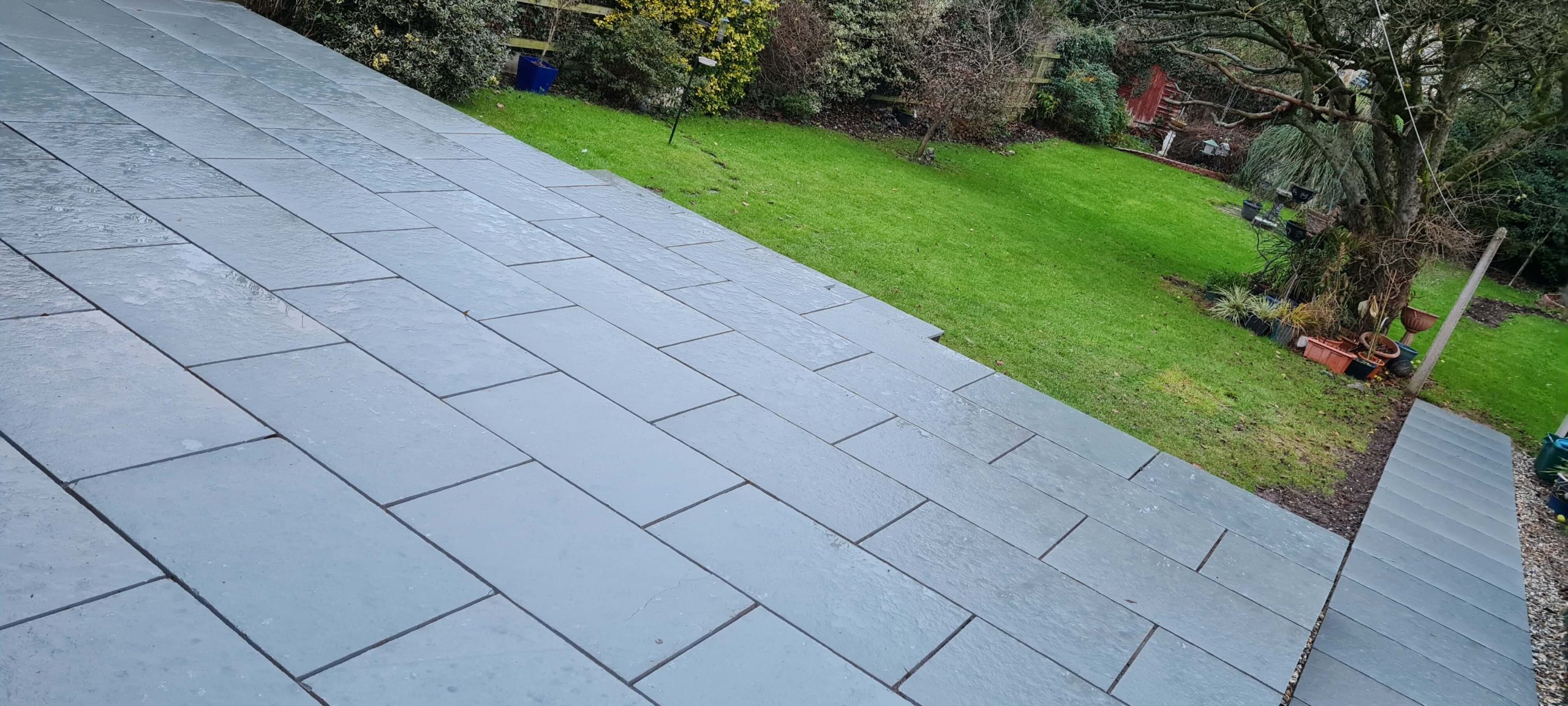 Grey garden patio paving with lawn and path in Staffordshire