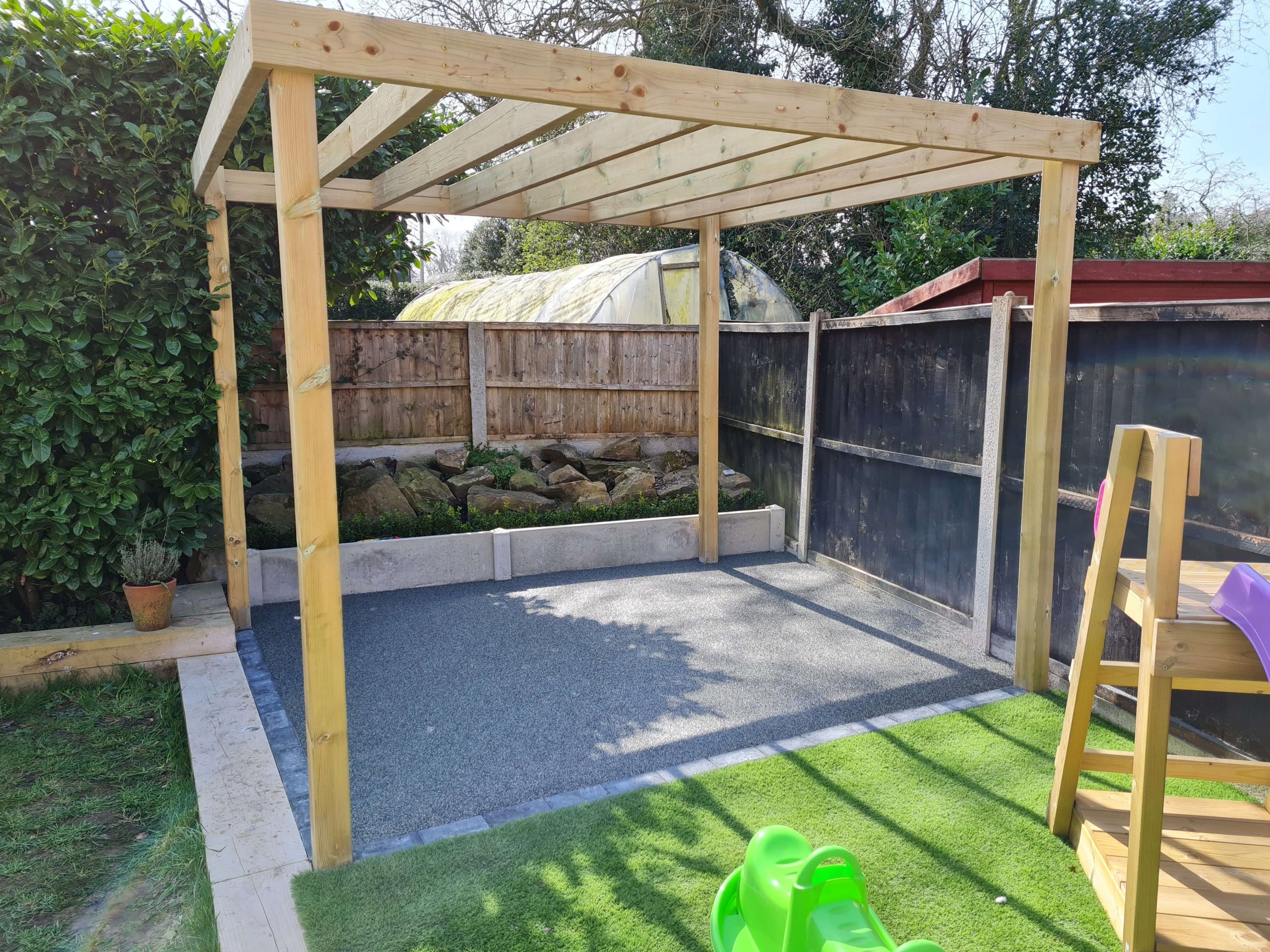 Timber garden pergola with gravel base and artificial grass in Staffordshire
